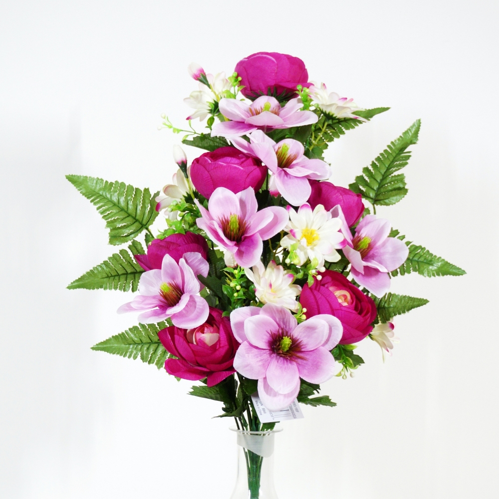 Mazzo frontale di ranuncolo e magnolai in tonalità beauty autunnale